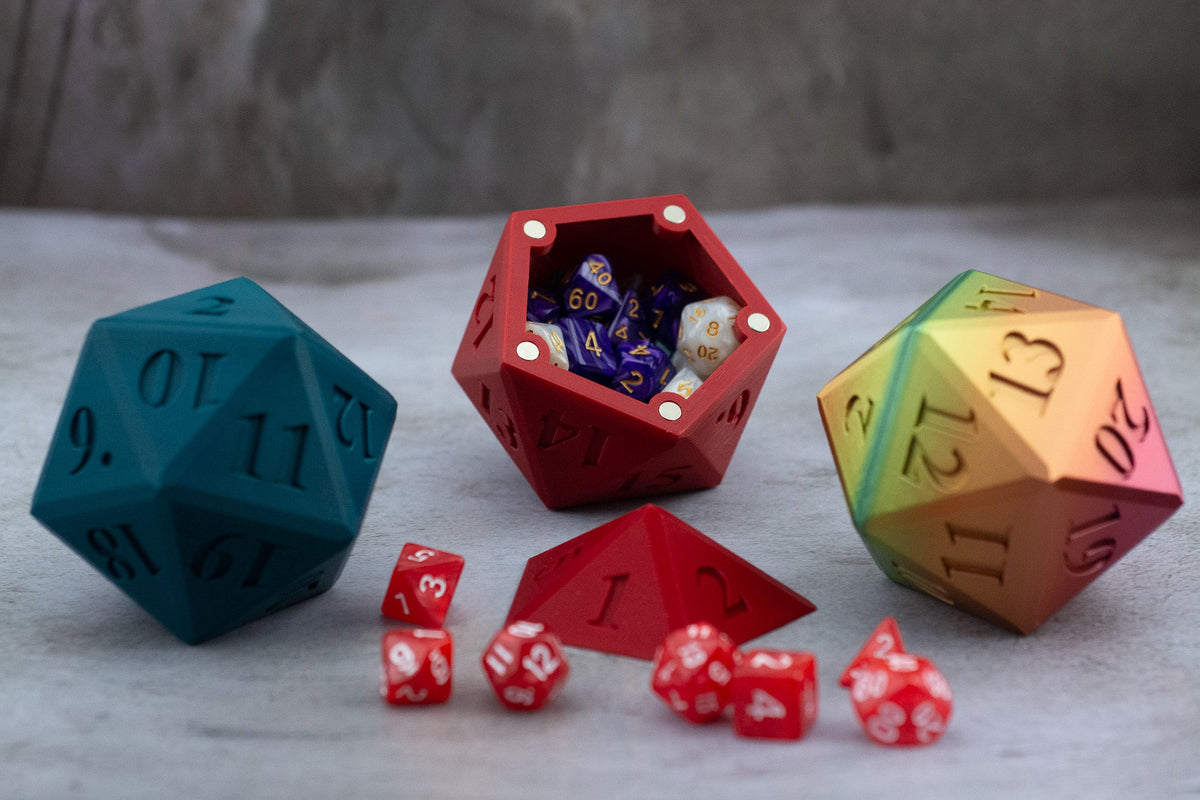 Teal, red and rainbow D20 dice vaults, the red one open and full of dice