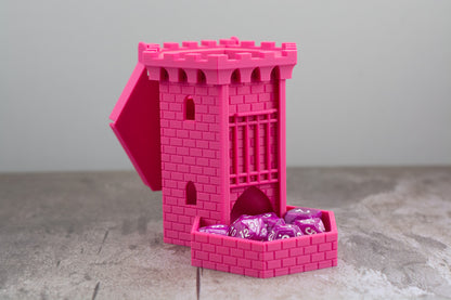 Pink castle dice tower with the lid open and dice stored in the tray