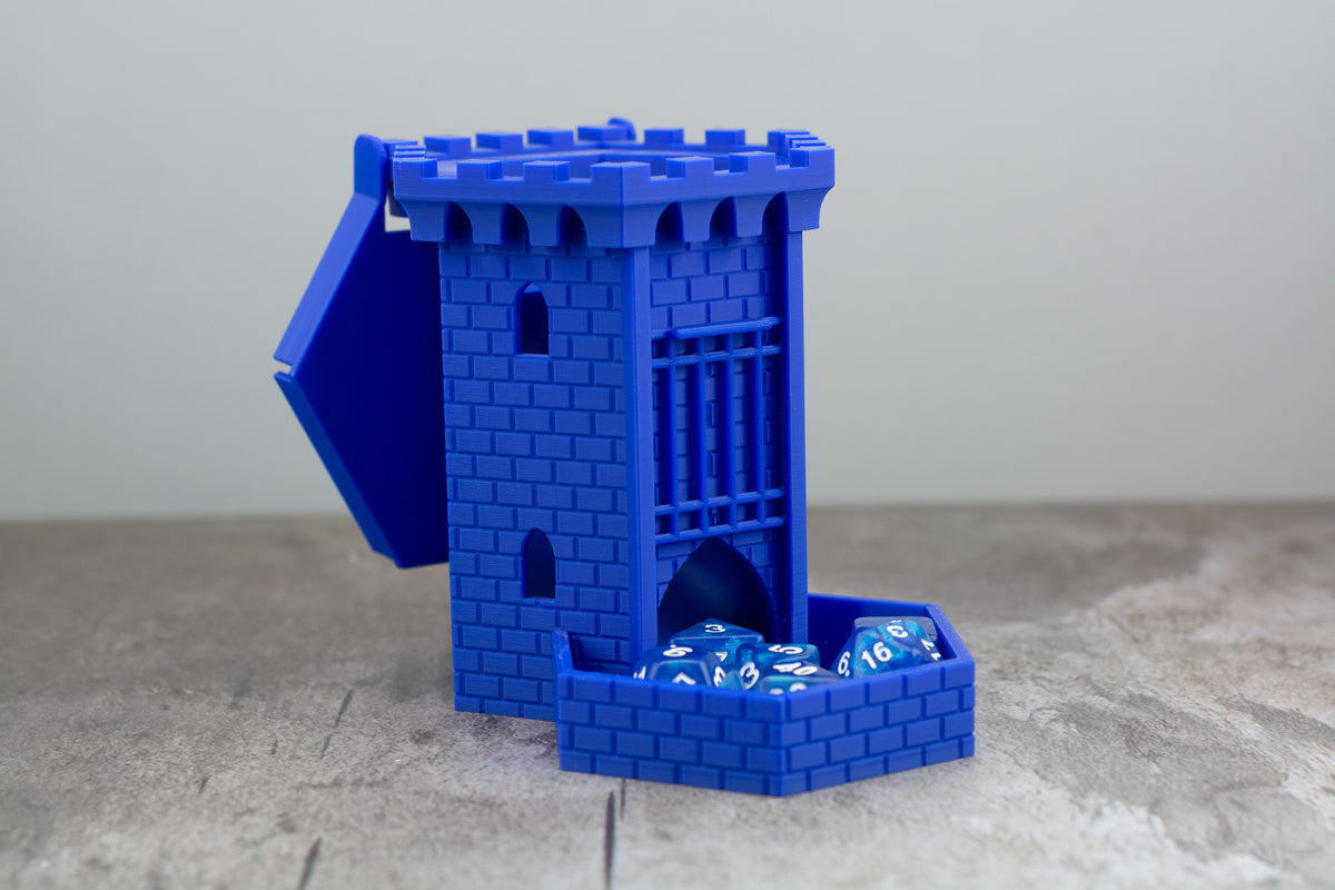 Blue castle dice tower with the lid open and dice stored in the tray