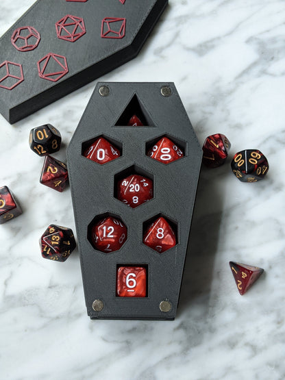 Open coffin dice vault with its seven dice slots filled, lid in the background